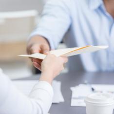 Teacher handing over a CV