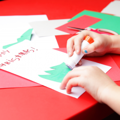 Primary pupil crafting a Christmas card using Tes Resources