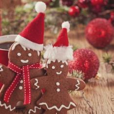 Gingerbread Man & Woman With Santa Hats Reflecting Festive Classroom Activities For EYFS, KS1 & KS2 Pupils