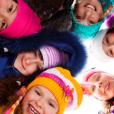 Primary children wearing winter clothes taking part in winter activity ideas for primary