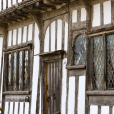 A Tudor house with wooden beams and white walls; studying Tudor housing and history in primary school