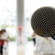 Microphone in front of a crowd; debates and speeches resources for secondary English students