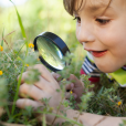Child Taking Part In Outdoor Learning Activity with Resource for Primary Pupils