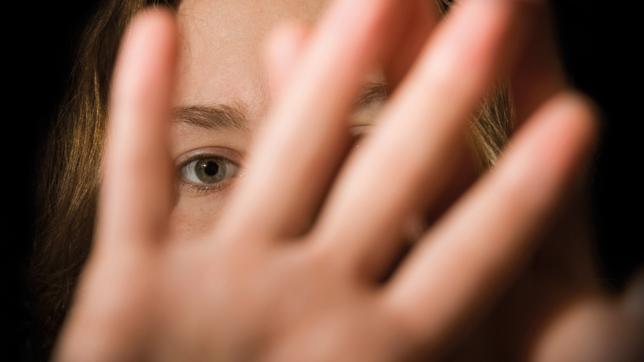 A girl with her hand up to the camera – coronavirus exam results cohort break