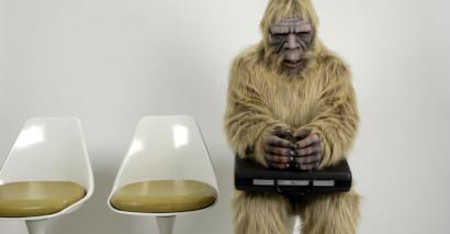 A Person In Fancy Dress Waits For A Job Interview