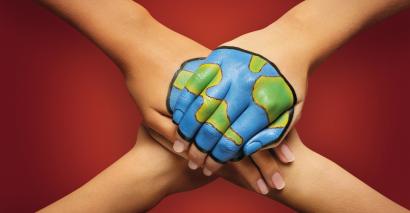 Students hands joined together painted with a world. Climate change resources for secondary students