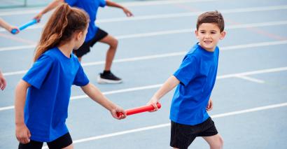 Primary pupils enjoying sports day and summer sports activities for PE