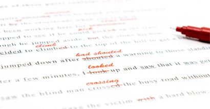 Secondary English student planning, drafting and editing their writing on paper