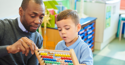 Teacher and pupil counting in 2s, 5s, 10s and 3s with Tes resource