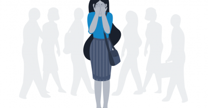 Illustration of a young female student wearing a blue top and long skirt. She has her head in her hands, looking upset with silhouettes of other students behind her.