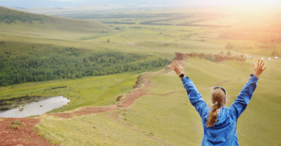 Student with their hands up in the air; geography challenges for early finishers and geography homework tasks for KS3 and KS4