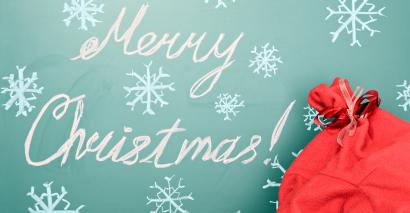 Merry Christmas sign with a sack of teaching resources