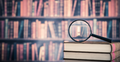Magnifying Glass On Booking To Illustrate Assessing Subject Knowledge In English With KS3, KS4 & Post-16 Secondary Students