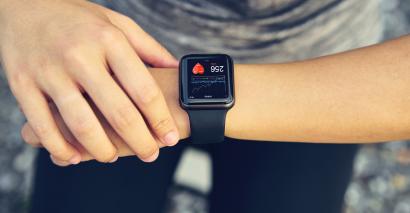 Person looking at their heart rate on a watch whilst exercising, healthy living resources