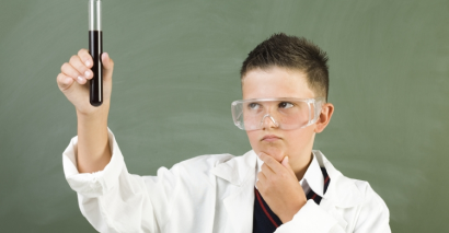 Curious Secondary Science student Investigating Test Tube At The Start Of Term