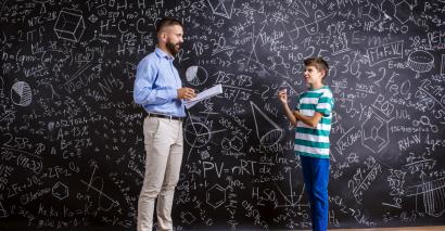 Teacher teaching secondary student motion lesson in science