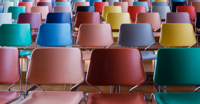 Empty School Chairs In Hall In Preparation For A School Assembly