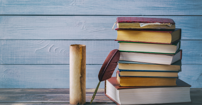 History books and scrolls for planning inspiration for secondary History KS3 and KS4
