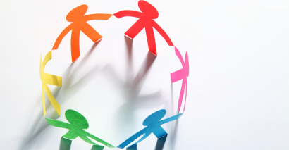 Paper People Holding Hands Representing Peace, Friendship & Resolved Conflicts