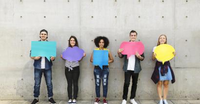 Students using MFL, French, Spanish and German speaking resources and holding up speech bubbles 