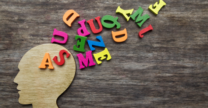 Letters coming from a head profile showing dyslexia and literacy