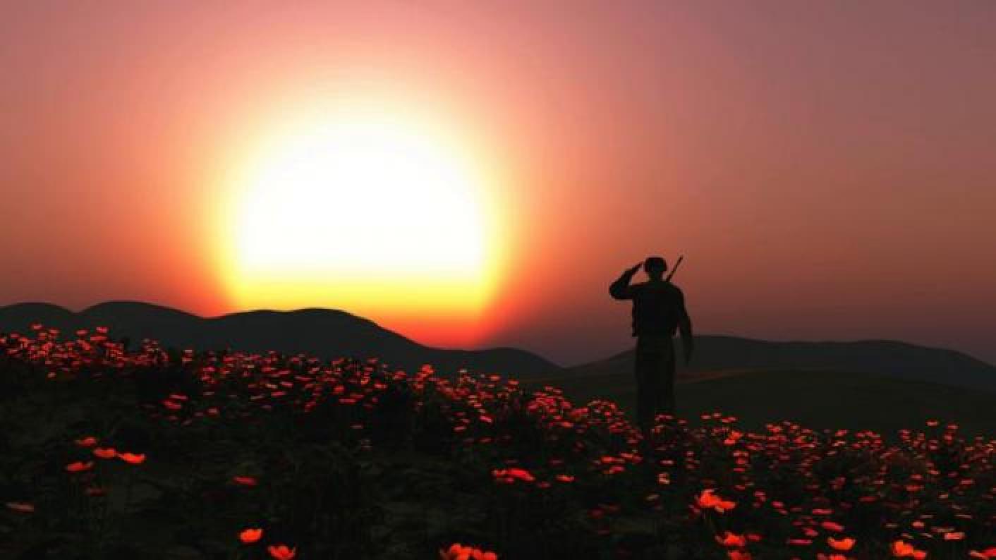 WW1 soldier saluting in a poppy field