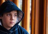 Schoolboy, looking mournfully into the distance