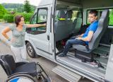 Boy in wheelchair, on special-school minibus