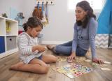parent playing maths game with child