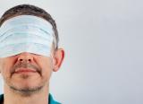 Covid unlocking: Man with face mask over his eyes