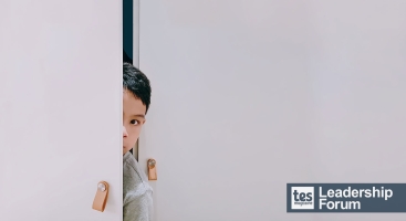 Child hiding in cupboard