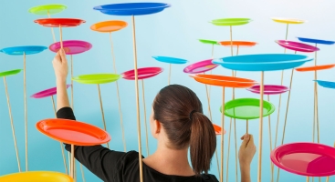 Woman spinning plates