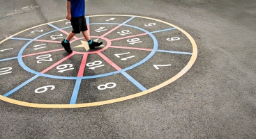 Pupil walking around numbers in playground