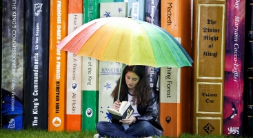 girl reading in the rain