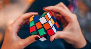 Woman solving rubik's cube