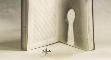 Girl with key to a book