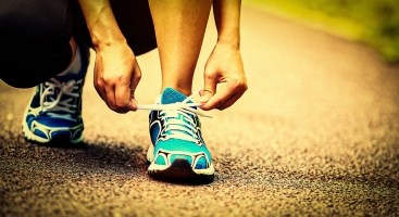 Tying laces on running shoe