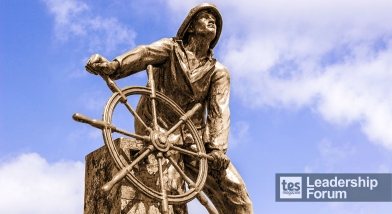 Sculpture of someone steering a ship