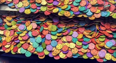 Multi-coloured coins in a coin-push machine