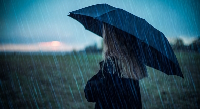 Girl with umbrella in rain