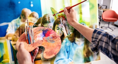 Artist painting picture of classroom