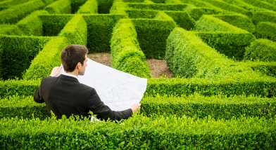 Man with a map in a maze