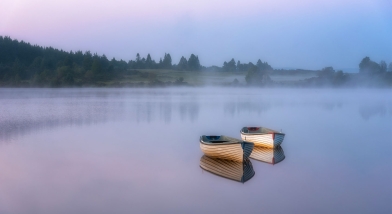Two small boats on calm water