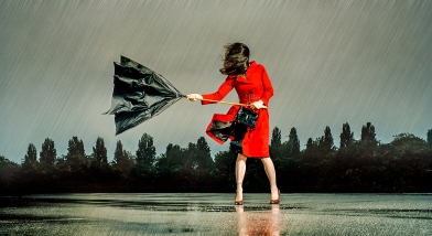 Lady with broken umbrella