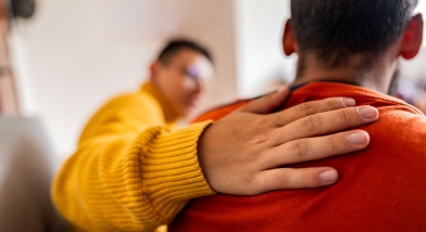 Someone comforting another