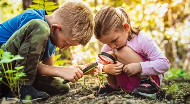 Two children learning about nature