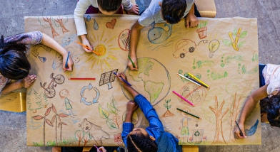 School kids working and drawing together