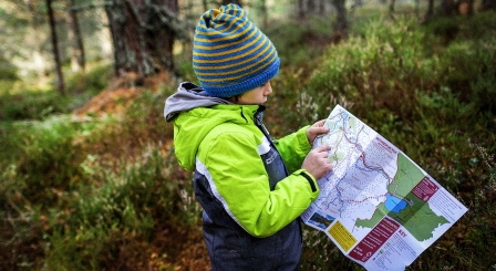 Boy reading map