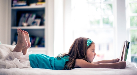 Girl on bed reading