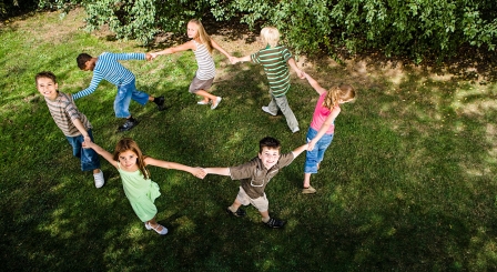 Children in ring holding hands